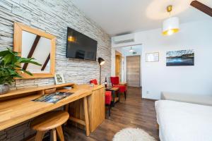 TV a/nebo společenská místnost v ubytování B&B Villa Sumrak Plitvica Rooms