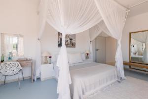 Letto o letti in una camera di Villa Santorini