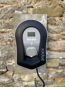 a pay phone is attached to a brick wall at Penbontbren Luxury Bed and Breakfast in Aberporth