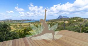 a statue of a woman with wings on a deck at Residence Hotel Lu Nibareddu in San Teodoro
