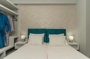 a bedroom with a large bed with two white pillows at Serenity Escape in Zakynthos Town +49 photos