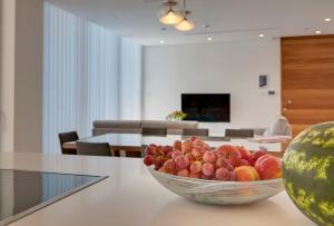 a bowl of fruit on a table in a living room at Sunrise Seaview Villas in Protaras