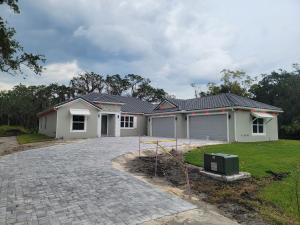 a house with a driveway in front of it at Voyager in Merritt Island