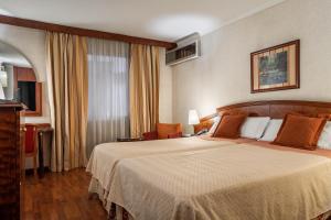 a hotel room with a bed and a window at ALEGRIA President in Andorra la Vella