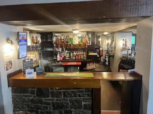 a view of a bar in a pub at The White Lion Hotel in Bridgend