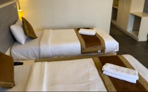 Hotel Dwarawata客房内的一张或多张床位