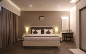 Hotel Dwarawata客房内的一张或多张床位