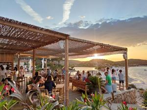 a rendering of a restaurant on the beach at Residence Hotel Lu Nibareddu in San Teodoro