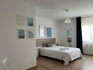 Postel nebo postele na pokoji v ubytování Apartagal-A Corredoira