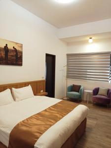 Postel nebo postele na pokoji v ubytování Lukang Inn