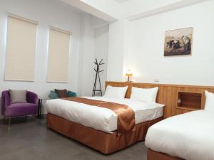 Postel nebo postele na pokoji v ubytování Lukang Inn