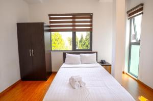 Postel nebo postele na pokoji v ubytování TTR Midtown View Hotel