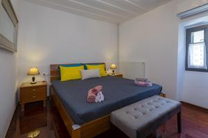 En eller flere senge i et værelse på Gala Estate Traditional Mansion