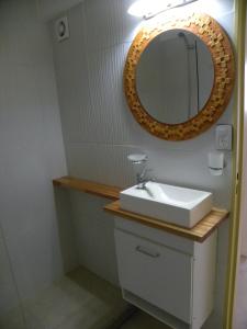 a bathroom with a sink and a mirror at Crespo Apartament Premiun in Buenos Aires