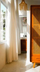 a bathroom with a sink and a window at Ulunia in Uluwatu