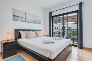 Ένα ή περισσότερα κρεβάτια σε δωμάτιο στο Residencial Las Candelarias 30