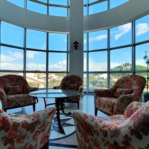 a room with chairs and a table and windows at AFYTOS ÖREN BEACH PRESTİJ in Burhaniye