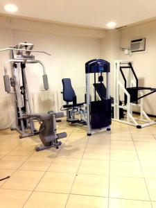 a gym with several tread machines in a room at Umbu Hotel Porto Alegre - Centro Histórico - Prox Aeroporto 15min in Porto Alegre