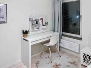 a white desk with a chair in a room at Room in Guest room - Room - 5 Min Walk Eurovision Hyllie in Malmö