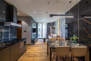 a kitchen and dining room with a table and chairs at Taiyo Hotel & Apartment in Da Nang