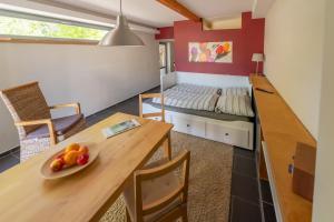 Ένα ή περισσότερα κρεβάτια σε δωμάτιο στο Ferienhaus an der alten Gärtnerei - Minze