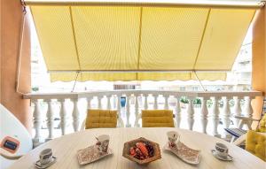 a table with a bowl of food on top of a balcony at 2 Bedroom Nice Apartment In Moncofa in Moncófar