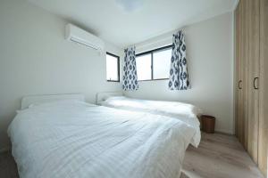 A bed or beds in a room at 清風小築