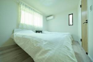 A bed or beds in a room at 清風小築