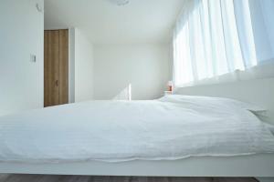 A bed or beds in a room at 清風小築