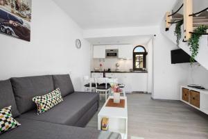 a living room with a couch and a table at Casa Sara Costa Calma in Costa Calma
