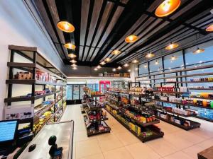 a grocery store aisle with many products on display at SkyNest by Merlion - Urban luxury apartment in Nairobi