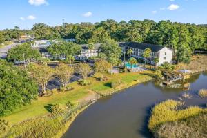 an aerial view of a resort with a river at Charleston Creekside Inn in Charleston
