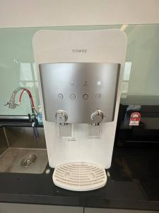 a white mixer sitting on top of a counter at New Brand KTV SET, Netflix, 3 Queen Bed High Floor in Jelutong