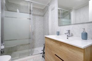 a bathroom with a sink and a shower at Apartamento Armonia in Torremolinos +22 photos