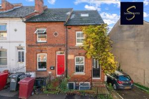 a red brick house with a red door at LUXE 3 BED - Central Reading - Free Parking in Reading