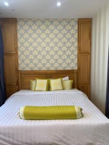 a bed with a large yellow tube on it at Panaroma Apartment Đà Lạt in Da Lat