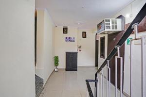 a hallway of a building with a stair case at OYO Hotel Dreamland Residency in New Delhi