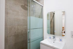 a bathroom with a sink and a glass shower at Gibraltar Nest 5-Hosted by Sweetstay in Gibraltar