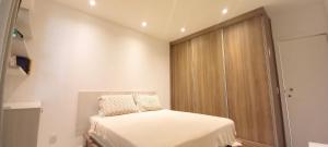 Кровать или кровати в номере Barra Lucio Golden Coast