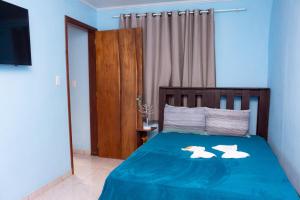 Postel nebo postele na pokoji v ubytování Pousada & Camping Recanto dos Anjos Azuis