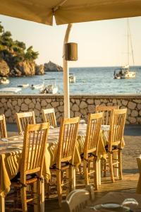 a table and chairs with a view of the ocean at PARALIA Souli di mare in Parga