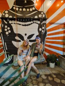 a man and a woman sitting on a swing at Bodhi El Valle in Valle de Anton +49 photos
