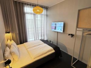 Letto o letti in una camera di CPH Hotel