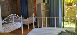 Postel nebo postele na pokoji v ubytování Maya guest house@coffee