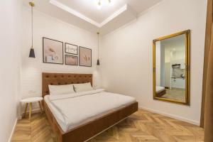 Katil atau katil-katil dalam bilik di Idea Design Apart-Hotel Chykalenka