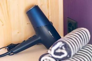 a hair dryer sitting on top of a table at The Swiss Bijou / Alpine Retreat in Stans