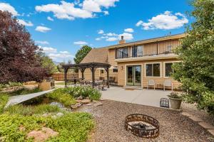 a house with a patio and a garden at V2 Mountain Retreat in Flagstaff