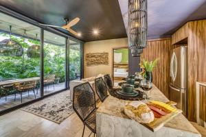 a kitchen with a table with bread on it at Divine 2BR Tulum on Cenote Gym in Tulum
