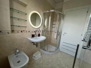 a bathroom with a sink and a shower and a toilet at Balcony House in Naples +36 photos