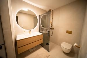 a bathroom with a sink and a mirror at Tromsø Town House in Tromsø +36 photos